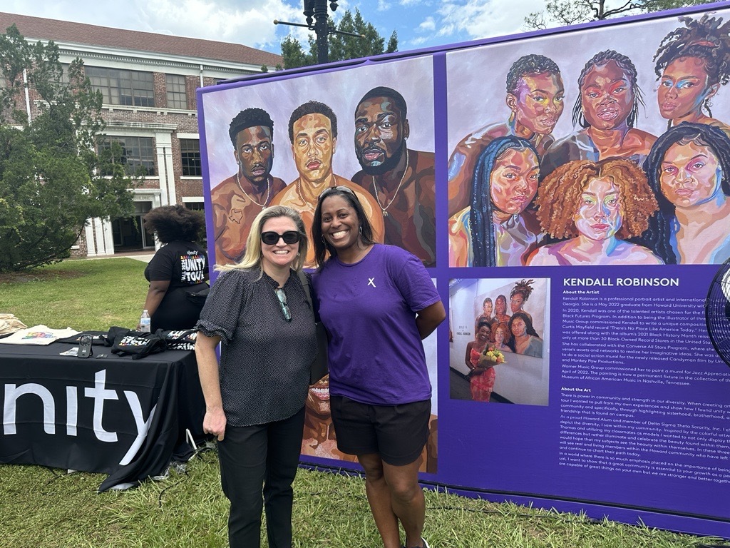 Comcasters pose for a photo at the Unity Tour event.