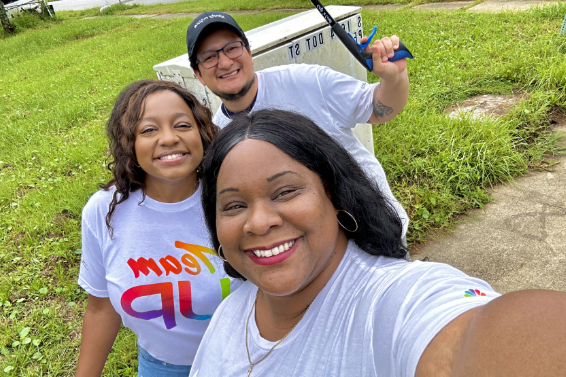 Volunteers take selfies during the clean up event