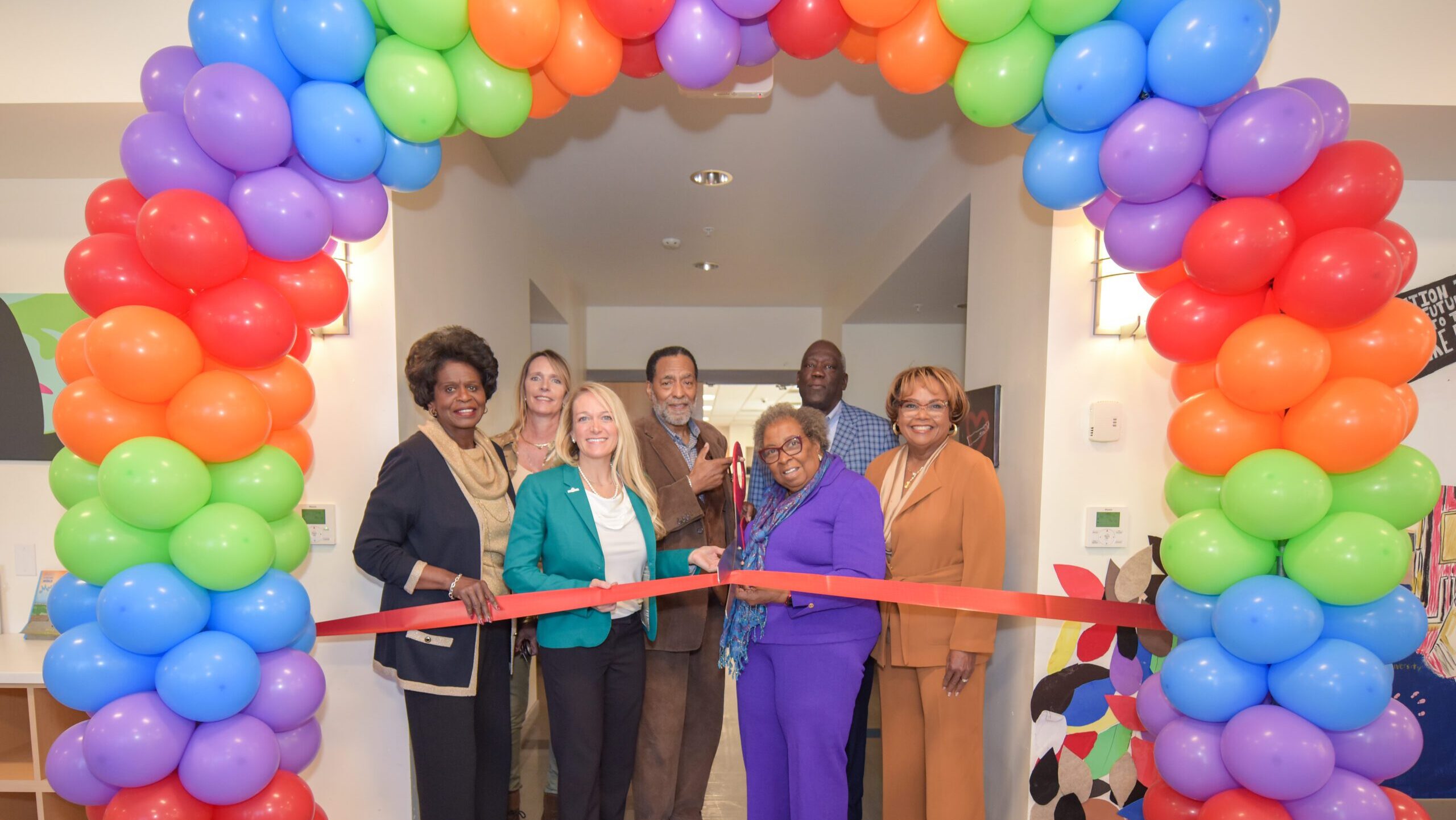 People at a ribbon cutting ceremony