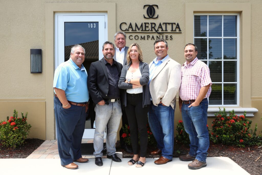 The Cameratta Companies team smiles for a photo.