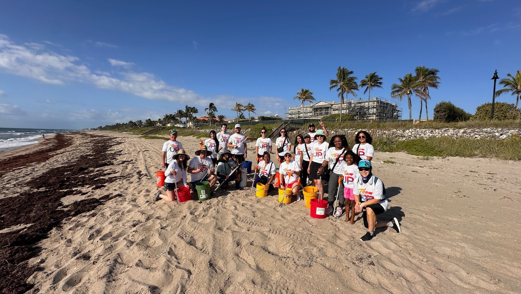 people cleaning a beach