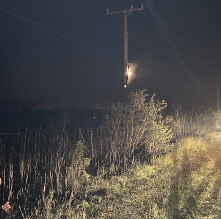 field with a burning lightpole