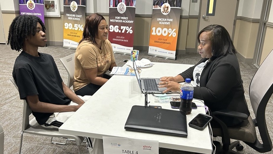 A family gets signed up for Internet Essentials