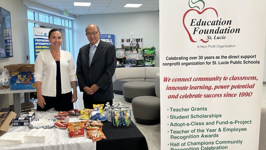 The Education Foundation team hands out snacks at the sign-up event.