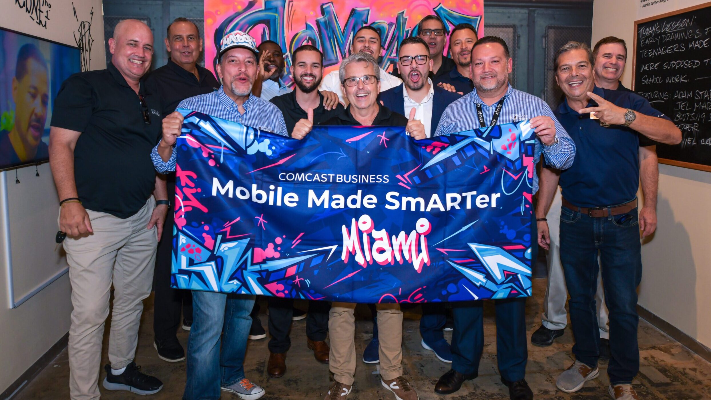 people posing with a mobile made smarter towel