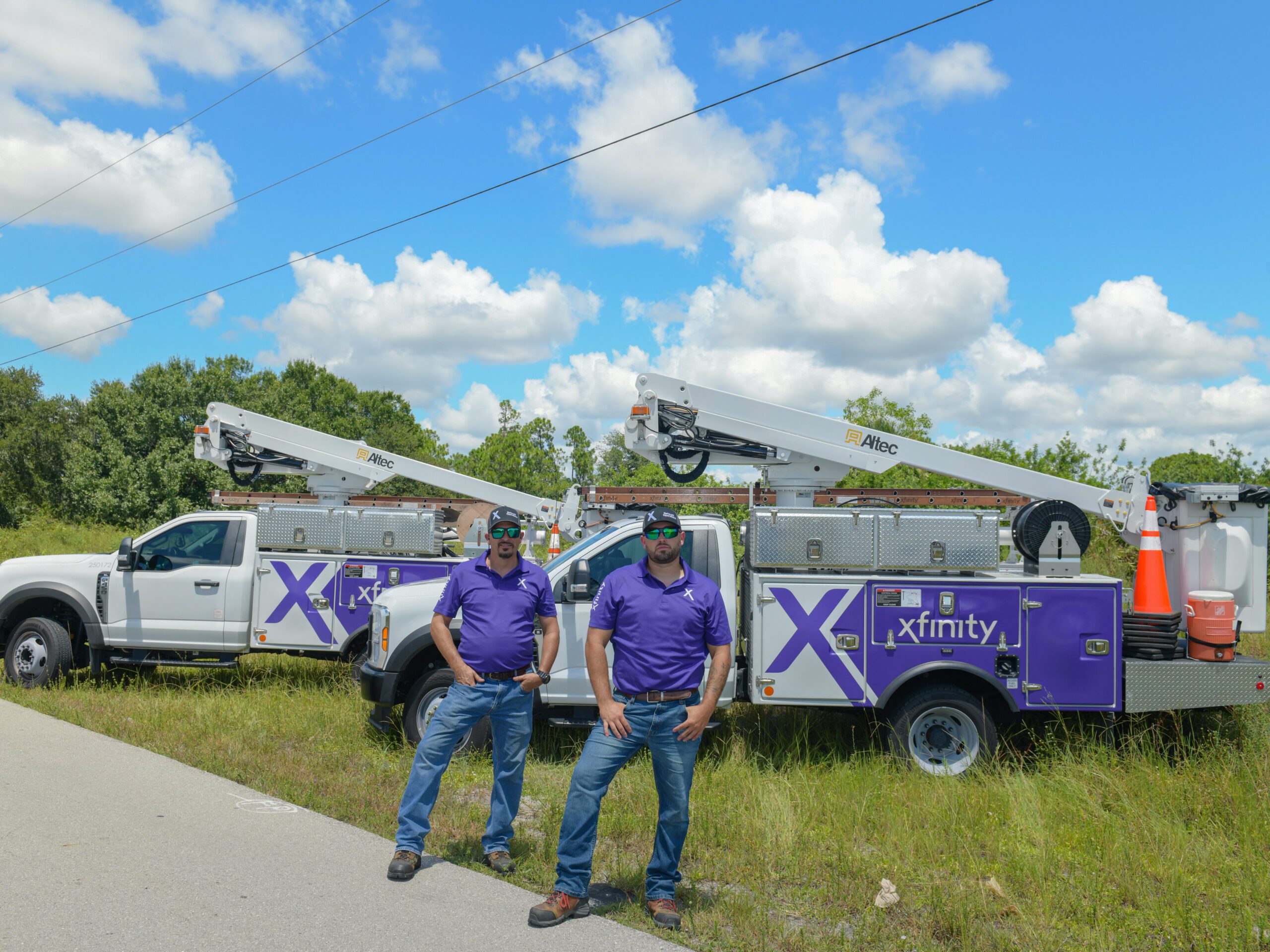 two men posing in front of a truck