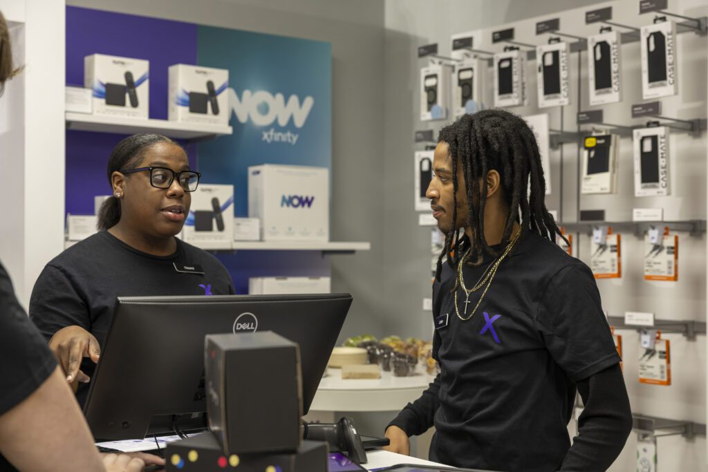 Xfinity employees provide service at the new store.